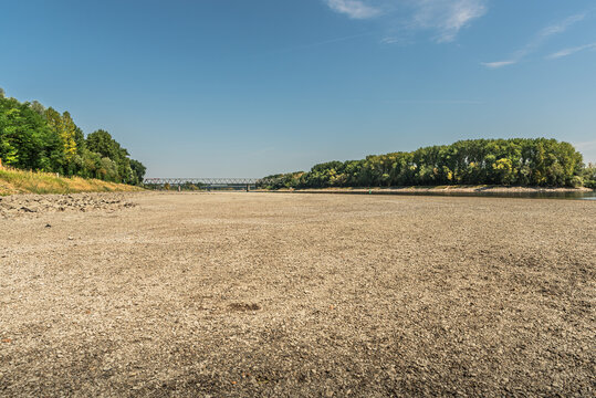 Low water level and vast dry riverbed of the Rhine River during summer drought, Germersheim, Germany