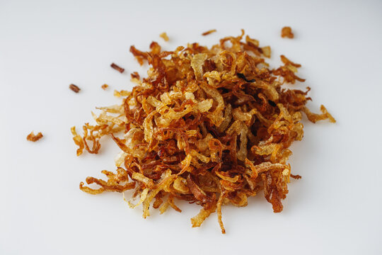 crispy golden fried onions on a white background