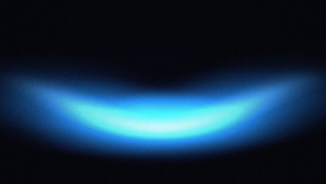 Gentle blue light arc with a bright center and diffused edges on black