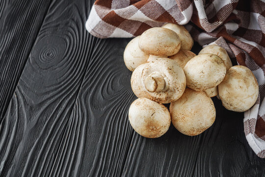 Fresh Champignons A Tasty and Healthy Ingredient on a Black Background