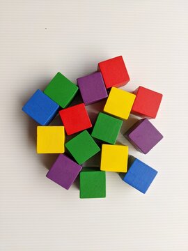wooden toy blocks. A group of colourful cube blocks isolated on white background