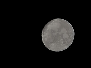 a perfect view of an almost full moon in the night sky © Riza faryunanda