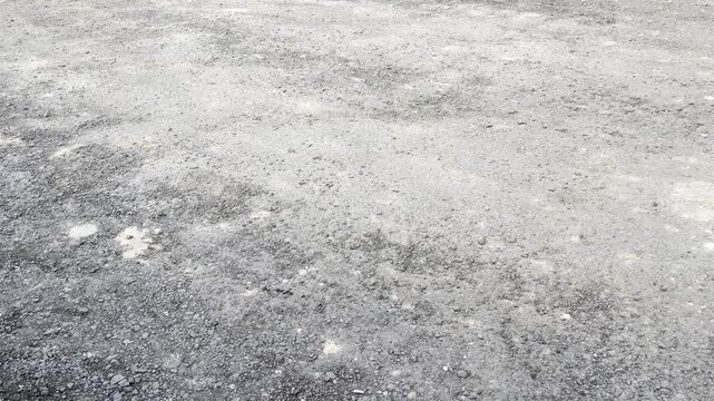 High angle view of rough concrete surface with granular texture