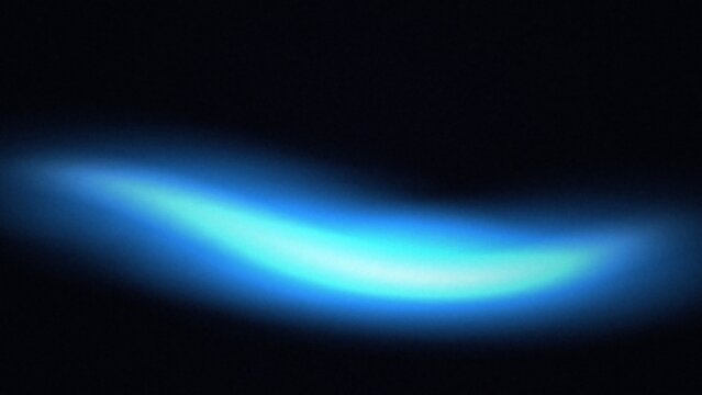 Wavy luminous light streak in vibrant cyan and blue against black
