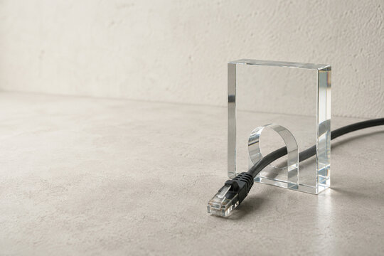Ethernet Cable Passing Through Clear Acrylic Block with Copy Space
