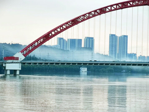 Red Arch Bridge Across Han River with City Skyline