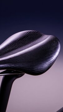 Close-up of a textured bicycle saddle showcasing its sleek design and ergonomic contours