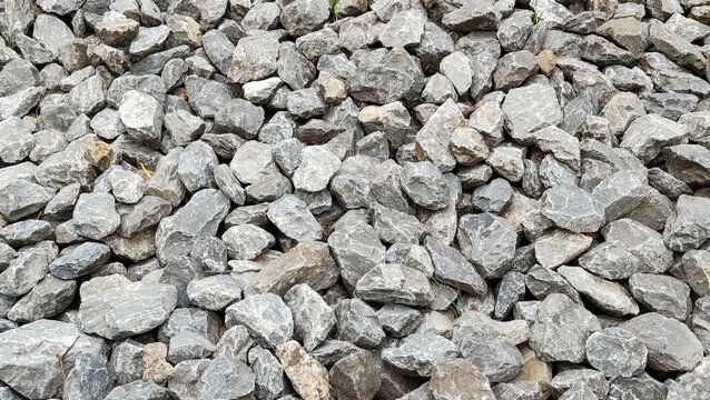 Crushed grey stone gravel background surface top view for construction and landscaping