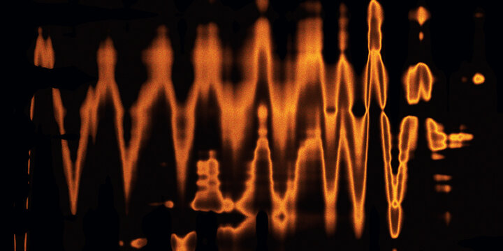 Abstract glowing orange sound wave distortion texture on black background