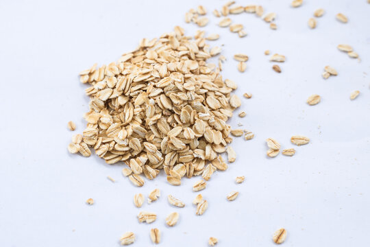 Rolled oats on white background.