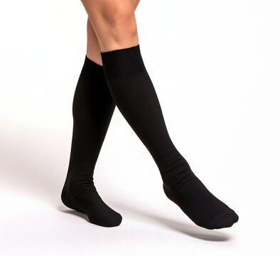 Individuals wearing black compression socks for medical benefits and enhanced circulation, photographed against a white backdrop, these garments are crafted for health and well-being