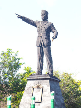 Bronze Statue of General Sudirman Pointing Forward on Stone Pedestal