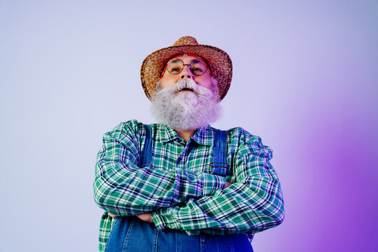 Senior old man with gray beard portrait in studio