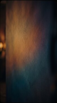 Abstract textured wall surface with soft warm and cool gradient lighting.