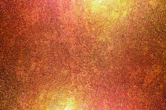 Color gradient dark grainy background, orange pink red gold yellow vibrant abstract on black, noise texture effect