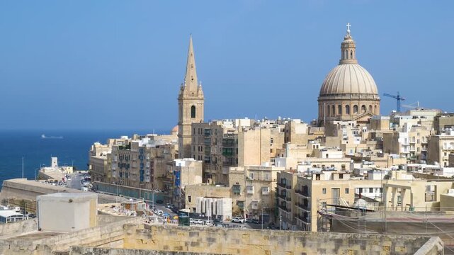 valletta dome and spire skyline framed close open sea in the foreground malta historic capital silhouette valletta skyline carmelite church dome st pauls anglican cathedral baroque skyline