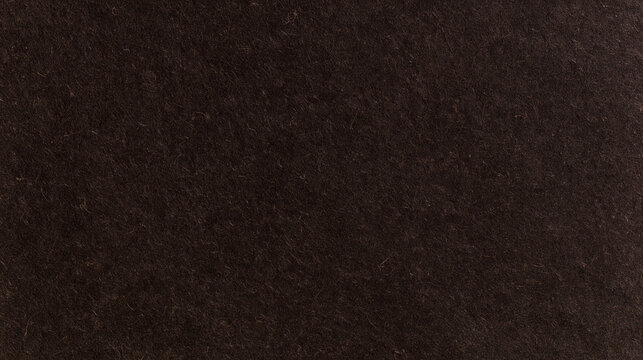 Dark recycled kraft paper texture background, deep brown natural pulp surface with lighter cellulose fibers and tiny irregular flecks, realistic compressed fiber structure,