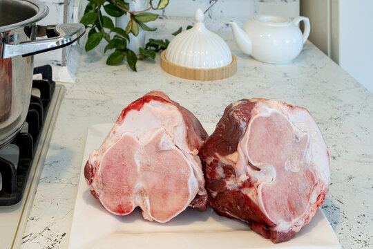 Raw beef shank cross-section with bone marrow, meat, tendons, and connective tissue. High collagen content for homemade bone broth to boost protein and support joints, ligaments, and skin health.