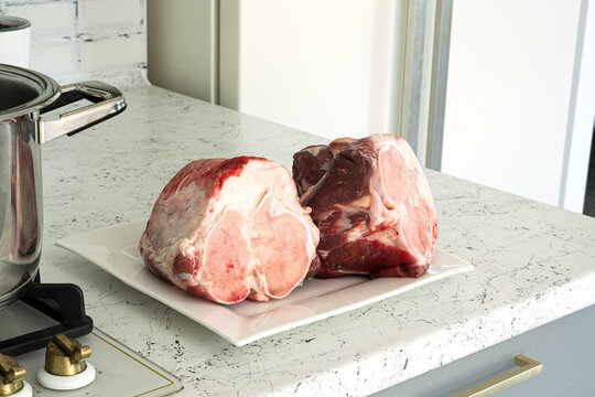 Raw beef shank cross-section with bone marrow, meat, tendons, and connective tissue. High collagen content for homemade bone broth to boost protein and support joints, ligaments, and skin health.