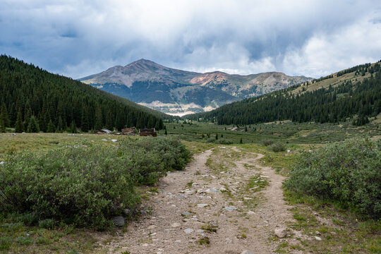 View of mountains from Mayflower Gulch Trail near Copper Mountain, Colorado under summer afternoon cloudscape.