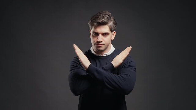 Serious Businessman Showing Firm Stop Gesture With Both Hands, Professional Male Rejecting An Offer Or Proposal, Expressing Refusal, Ban, Restriction, Warning And Disagreement