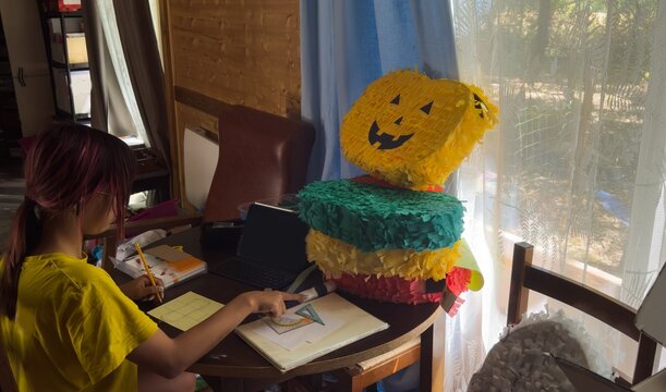 The girl is doing creative work.