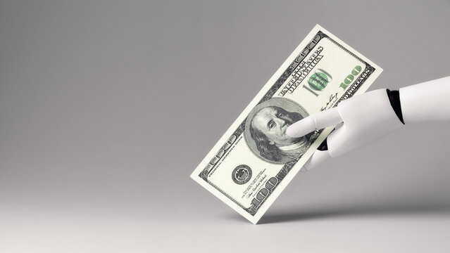 A white robotic hand holding a US hundred-dollar bill against a gray background. Concept of artificial intelligence, cryptocurrency exchanges and digital money.