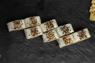 Overhead Sesame Sushi Roll on Black Slate © nayefhammouri