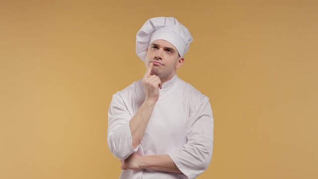 Brilliant Male Chef In White Uniform And Toque Having Eureka Moment, Suddenly Getting Creative Cooking Idea, Pointing Up With Inspiration, Innovation, Solution And Culinary Concept