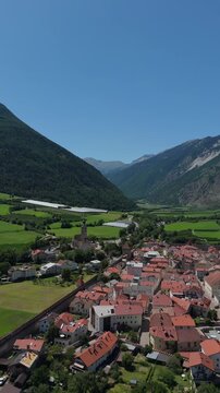 Vertical Drone Flying Forward Over Glurns Medieval Walled Town Italy