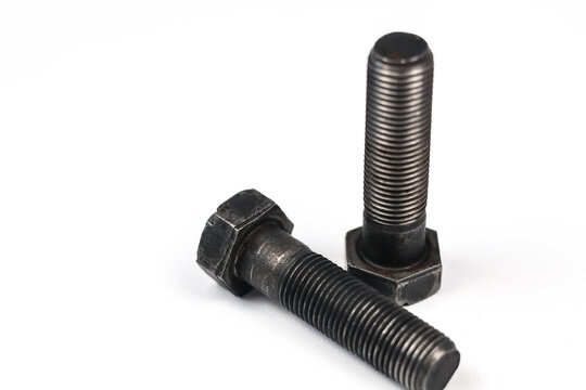 Two black steel hex bolts isolated on white background.
