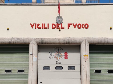 Ostia, Rome, Italy - March 12, 2026, perspective view of the facade of the historic building, with the red sign, which houses the Fire Brigade Station.