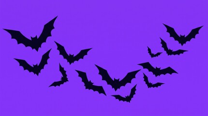 Obraz premium Silhouettes of flying bats against a vibrant purple background perfect for halloween themed designs and spooky concepts