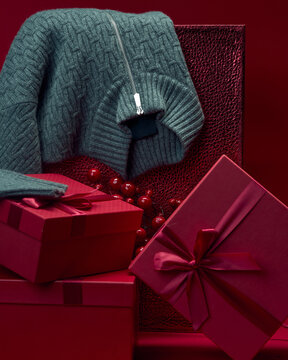 Cashmere sweater and gift boxes during holiday season