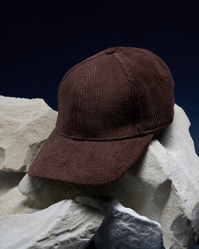 Brown cap placed on gray stones