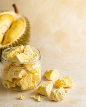Freeze-Dried Durian Pieces in a Jar on a Minimal Background