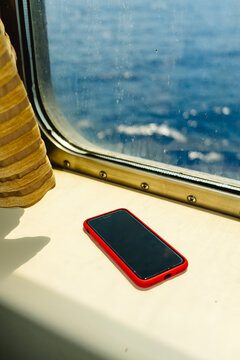 Smartphone by Ferry Window