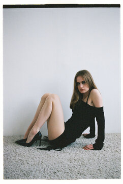 Model poses in a simple setting with neutral colors