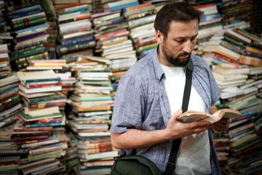 Reading Amid Towering Bookshelves