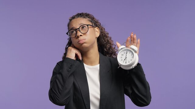 Tired Young Student Holding An Alarm Clock And Sighing Early In Morning, Sleepy Girl Reluctant To Wake Up, Morning Fatigue, Lack Of Sleep, Daily Routine And Time Management