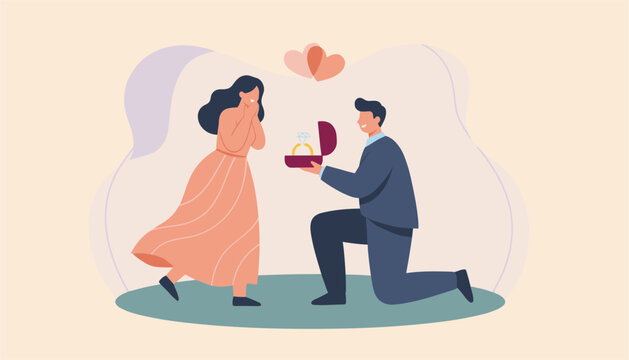 Romantic young man on one knee proposing to his surprised girlfriend with an engagement ring in a red jewelry box.
