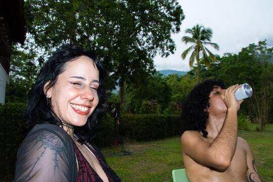 Friends Enjoy Drinks in Nature During a Sunny Day
