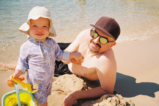 Father and daughter on the beach 