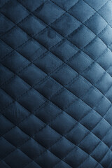 Obraz premium Close-Up of Dark Blue Quilted Velvet Fabric with Elegant Diamond Upholstery Pattern