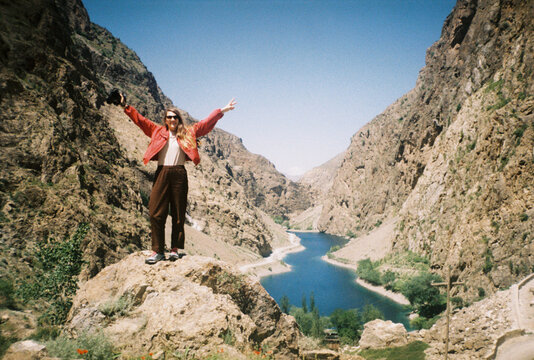 Woman Stands on a Rock in Haft Kul region, Tajikistan