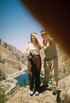 Couple Stands on a Rock in Haft Kul region, Tajikistan