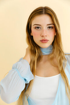 Woman wearing sheer blue blouse 