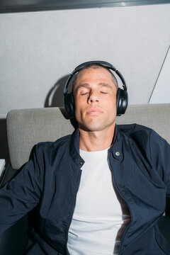 Listening to Music Closed Eyes in Airport
