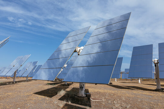 Heliostat mirrors collecting solar energy at power plant