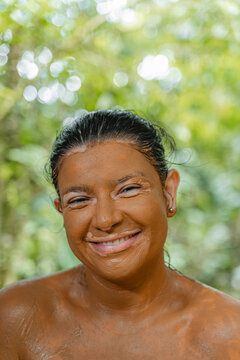 Subject enjoying natural mud bath skin care treatment
